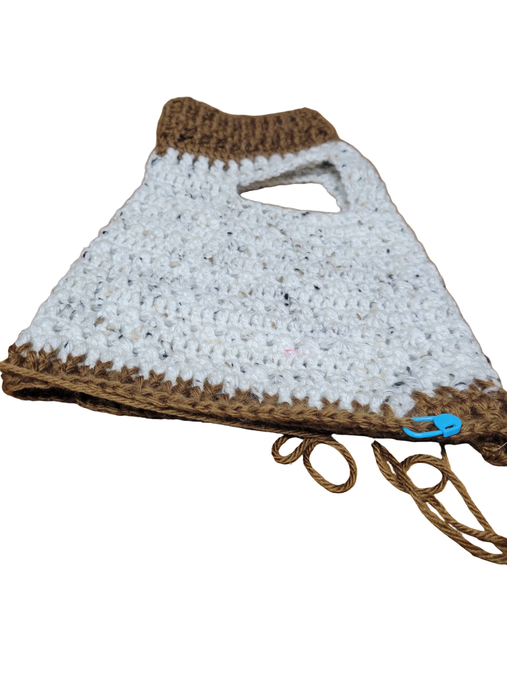 White crocheted puppy sweater with brown trim and tie cords.